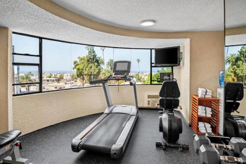 a fitness room with a treadmill and a tv at Quality Inn & Suites Hermosa Beach in Hermosa Beach