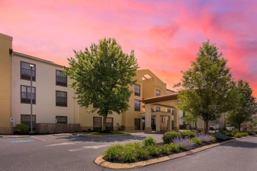 a rendering of a building with trees in a parking lot at Comfort Suites near Penn State - State College, PA in State College