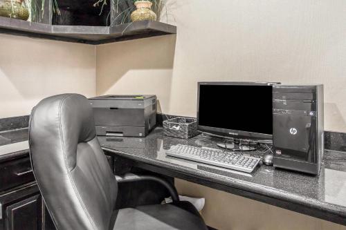 an office with a desk with a computer and a chair at Sleep Inn & Suites West Medical Center in Amarillo