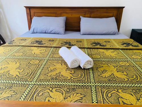 Postel nebo postele na pokoji v ubytování RR Home Stay