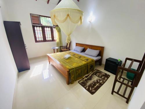 Postel nebo postele na pokoji v ubytování RR Home Stay