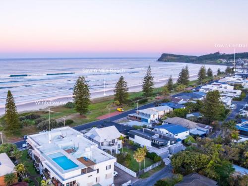 an aerial view of a beach with houses and the ocean at Wintersview 9 - Lennox Head in Lennox Head