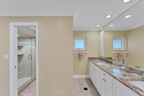 a bathroom with two sinks and a shower at GRH14784 - Charlotte County - 4 Bed 2 Baths House in Punta Gorda Isles