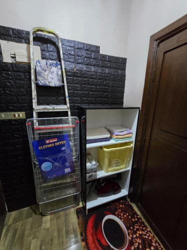 a refrigerator with its door open with a basket at Deluxe Furnished Studio Jubaiha in Amman