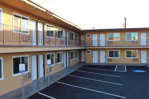 a view of a building with a parking lot at Rodeway Inn Yuma Downtown in Yuma
