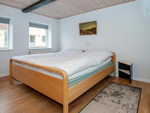 a bedroom with a bed in a room at Enchanting Cottage in Oksbol Oasis-By Traum in Nordborg