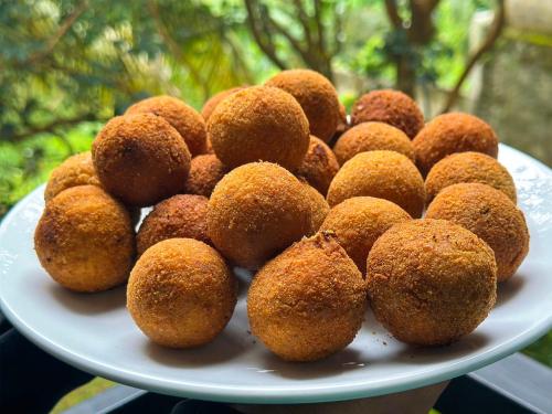 a plate of donuts sitting on a table at Travel Neth Mountain Bungalow Kandy in Kandy