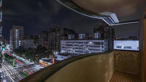 a view of a city skyline at night at Hotel G7 Taipei in Taipei