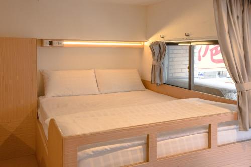 Postel nebo postele na pokoji v ubytování Fun Inn Taipei Hostel