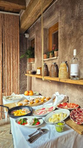 a table with many plates of food on it at Locanda da Enzo in Rome