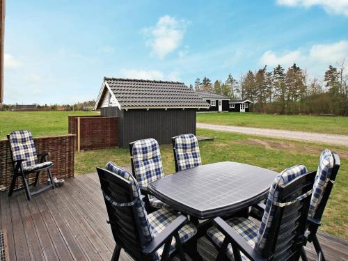 a patio with a table and chairs on a deck at Family Retreat in Hovborg - By Traum Ferienwohnungen in Hovborg