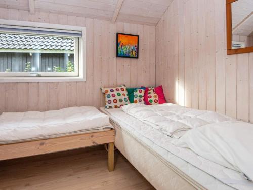 a room with two beds and a window at Family Retreat in Hovborg - By Traum Ferienwohnungen in Hovborg