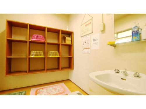a bathroom with a sink and a white sink at Hotel Itakura - Vacation STAY 70076v in Fukushima