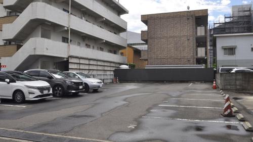 a parking lot with cars parked next to a building at Hotel Itakura - Vacation STAY 70076v in Fukushima