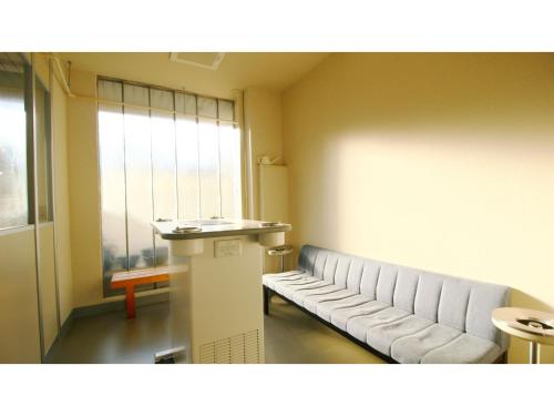 a waiting room with a bench and a window at Hotel Itakura - Vacation STAY 70076v in Fukushima