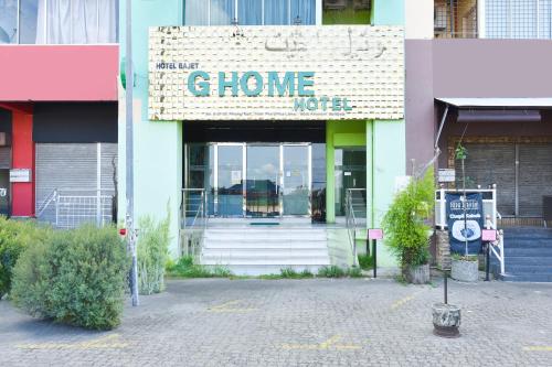 a store front with a sign that reads chlorine root at Dancenter G Home Hotel in Kota Bharu