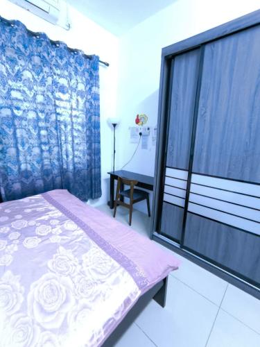 a bedroom with a bed and a large window at Homestay Annur Impian Temerloh With WIFI & NEXFLIX in Temerloh