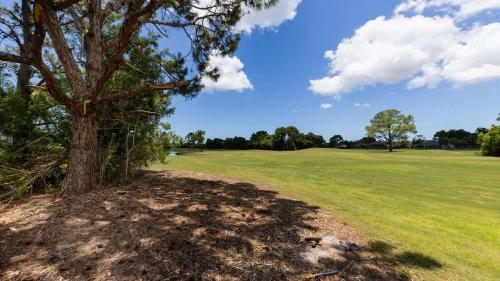 a tree in the middle of a field at GRH11408 - Charlotte Harbor Area - 3 Bed 3 Baths Villa in Rotonda