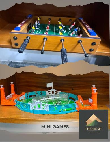a wooden game table with a boat in a box at The Escape - Malolos in Mujon