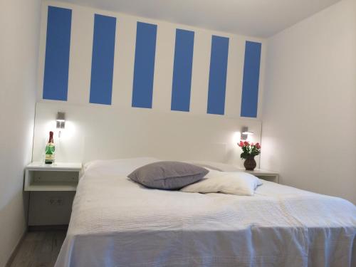Postel nebo postele na pokoji v ubytování Ferienzimmer Lütt