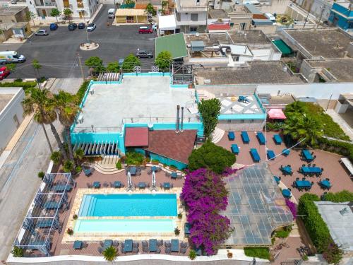 an overhead view of a pool at a resort at Residence La Scogliera in Torre Colimena