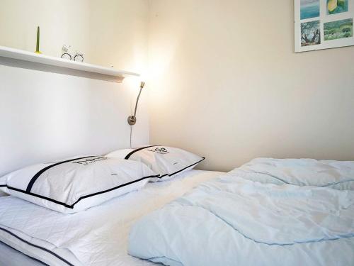 two beds sitting next to each other in a room at Scenic Seaside Retreat in Sandkas-By Traum in Allinge