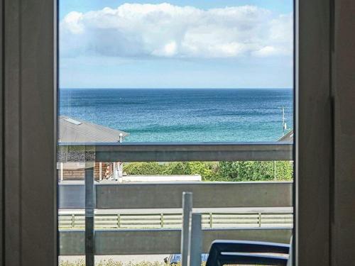 a view of the ocean from a window at Scenic Seaside Retreat in Sandkas-By Traum in Allinge