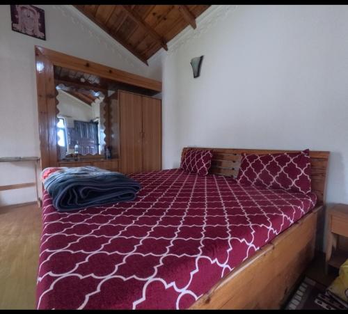 Postel nebo postele na pokoji v ubytování Tulip Cottage Ramgarh Mukteshwar