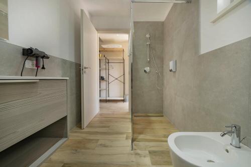 a bathroom with a sink and a toilet and a shower at Italianflat - FREE parking, Salted Swimmingpool - Casa Ulivi del Garda in Castion Veronese