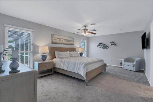 a bedroom with a bed and a ceiling fan at GRH14276 - Charlotte Harbor Area - 3 Bed 2 Baths Villa in Punta Gorda Isles