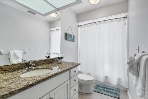 a bathroom with a sink and a toilet and a shower at GRH14276 - Charlotte Harbor Area - 3 Bed 2 Baths Villa in Punta Gorda Isles