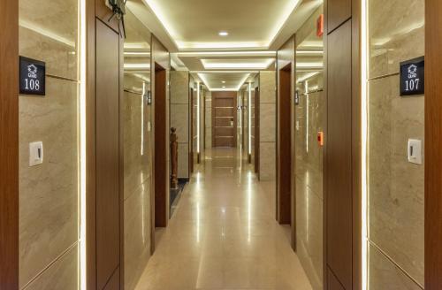 a corridor in a building with a hallway at The Grand in Thekkady