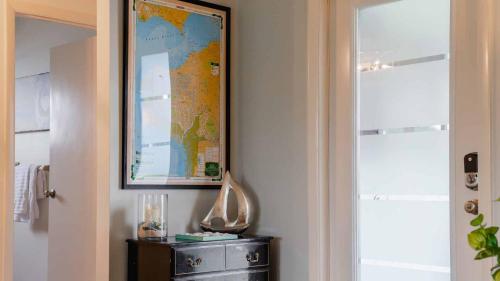 a map is hanging on a wall next to a mirror at GRH11506 - Charlotte Harbor Area - 2 Bed 2 Baths Villa in Punta Gorda Isles