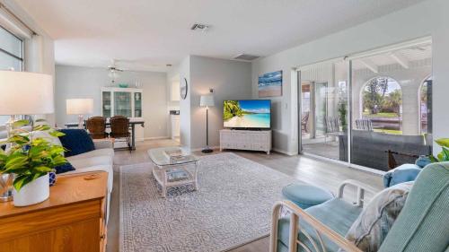 a living room with a couch and a tv at GRH11506 - Charlotte Harbor Area - 2 Bed 2 Baths Villa in Punta Gorda Isles