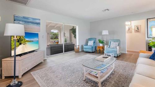 a living room with a couch and a tv at GRH11506 - Charlotte Harbor Area - 2 Bed 2 Baths Villa in Punta Gorda Isles