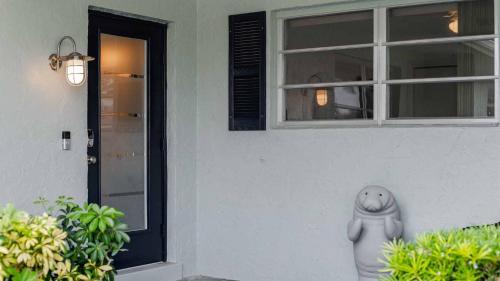 a statue of a seal sitting in front of a house at GRH11506 - Charlotte Harbor Area - 2 Bed 2 Baths Villa in Punta Gorda Isles