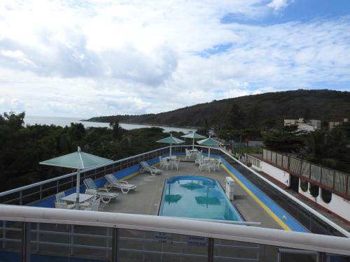 a view of the pool on the roof of a hotel at Fragata Hotel in Guarapari