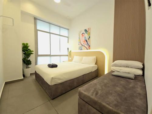 Letto o letti in una camera di Mahkota Superb View Apartment near A’Famosa & Jonker