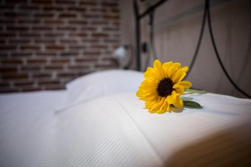 Postel nebo postele na pokoji v ubytování Hotel Le Botti