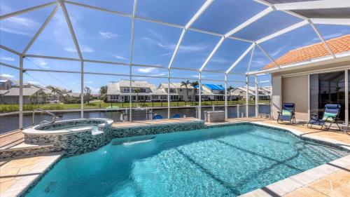 a large swimming pool with a large glass roof at GRH14127 - Charlotte Harbor Area - 3 Bed 2.5 Baths Villa in Punta Gorda Isles