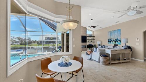 a living room with a table and chairs at GRH14127 - Charlotte Harbor Area - 3 Bed 2.5 Baths Villa in Punta Gorda Isles