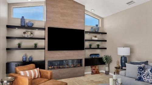 a living room with a fireplace and a flat screen tv at GRH14127 - Charlotte Harbor Area - 3 Bed 2.5 Baths Villa in Punta Gorda Isles