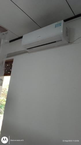 a white tv in a ceiling in a room at Hiriketiya Lima Homestay in Dickwella