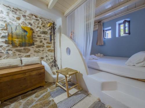 Ένα ή περισσότερα κρεβάτια σε δωμάτιο στο The Architect's Village House