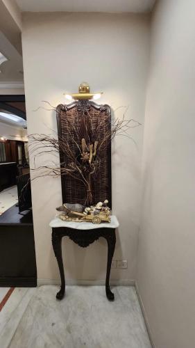 a table in the corner of a room at Nayra Apartment by Jaiswal House in Kolkata