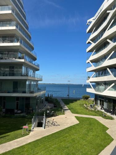 a large apartment building next to the water at Waterfront apartment in Aarhus