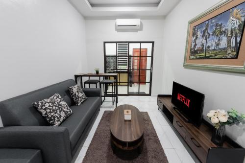 Гостиная зона в Rumahkita Beranang TJS Holiday Homes