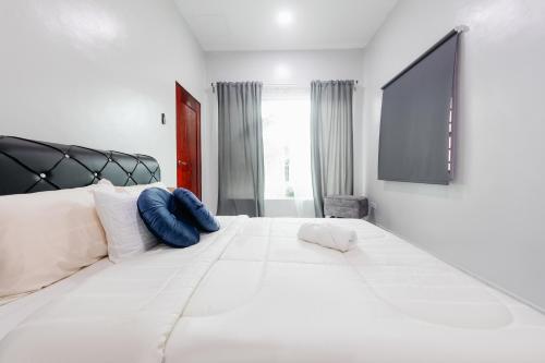 Кровать или кровати в номере Rumahkita Beranang TJS Holiday Homes