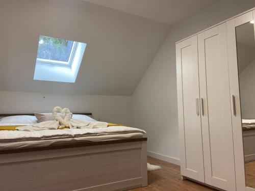 a bedroom with a bed and a window at Filuma Suite with private terrace and balcony PANORAMIC GACKA VIEW in Otočac