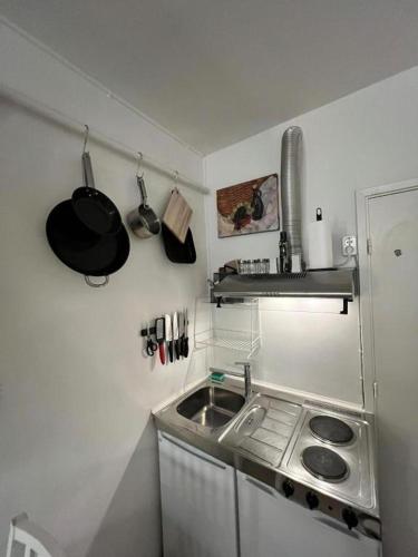 a small kitchen with a sink and a stove at Your Cozy Studio - Just Minutes from Copenhagen Airport in Copenhagen